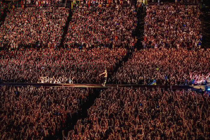 Chris Martin of Coldplay gliding down the runway at one of the group's sold out Wembley Stadium shows. Taken by Luke Dyson. This image won at the Event Photography Awards 2023